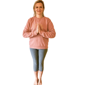 woman standing namaste yoga position with Tabitha Yoga Sunburst Logo Sweatshirt