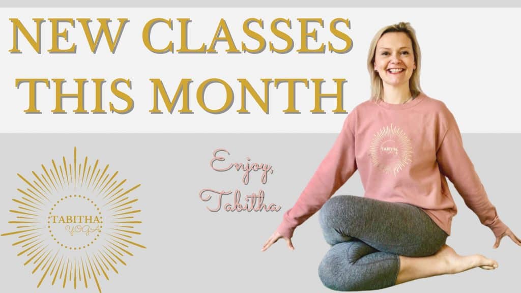 Tabitha Yoga sitting crossed legged with New Classes This Month written beside her