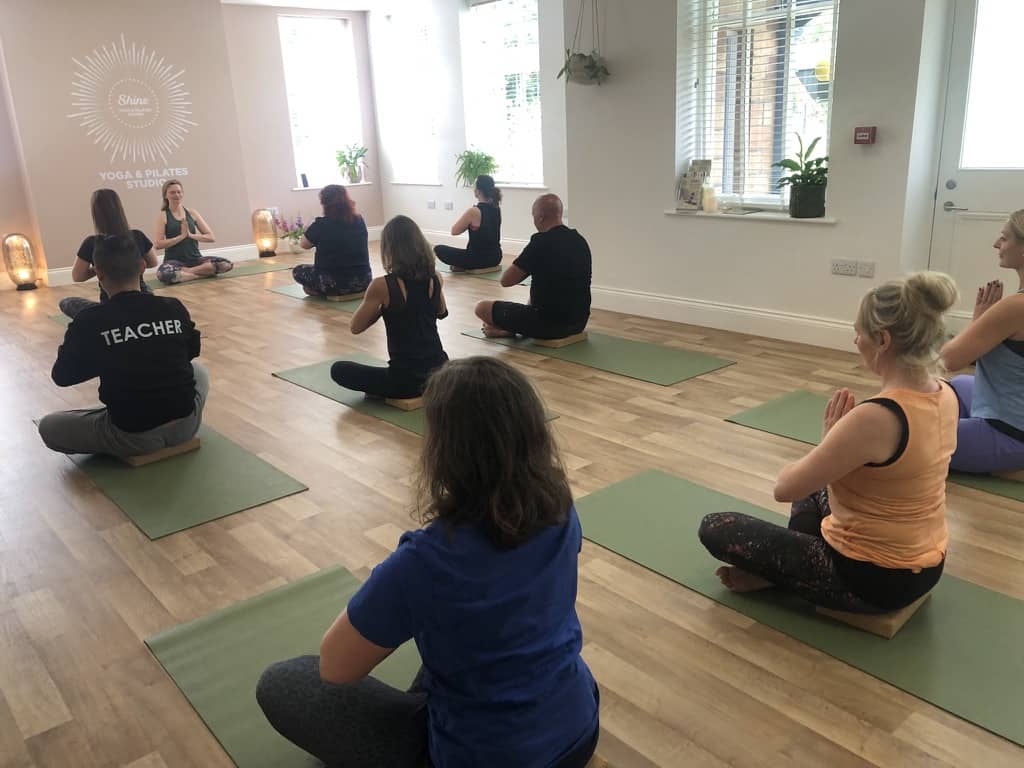 tabitha wright teaching a yoga class at Shine With Tabitha Yoga Studio